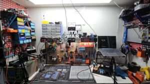 Workshop with many things hanging on the wall and impressive soldering and electronics equipment